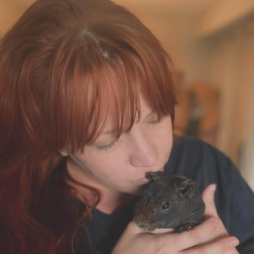Sara Hunter Kissing a guinea pig
